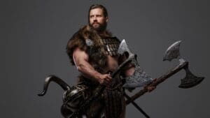 Guerreros en combate medieval con armadura durante un festival histórico en Madrid con público, música épica y ambiente inmersivo